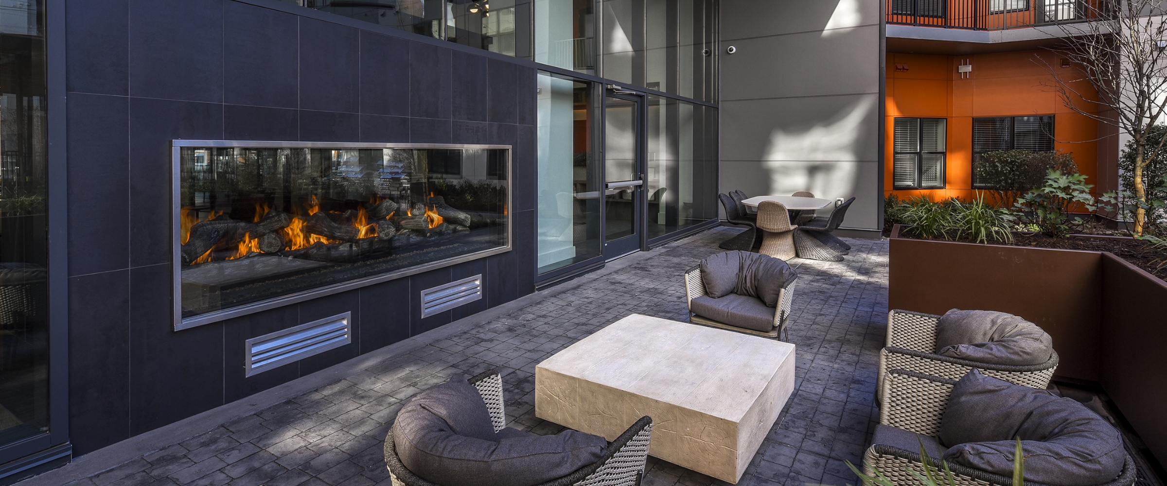 Outdoor seating with fireplace at our Locust Point apartments.