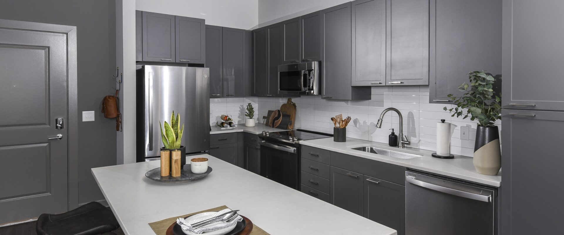 Modern kitchen with island at our Federal Hill apartments.